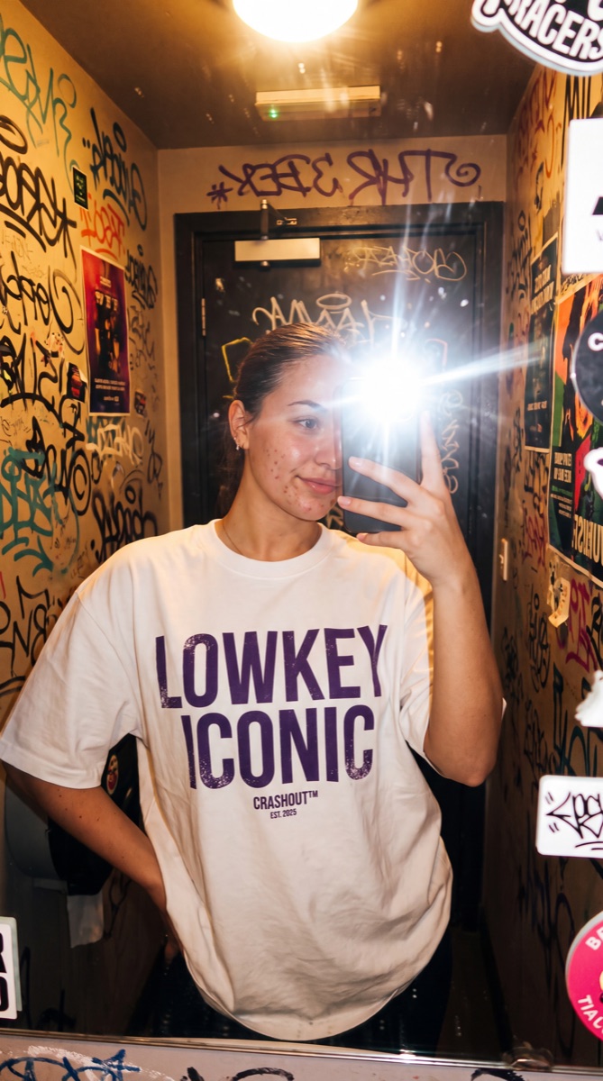 Cast member with flash — Lowkey iconic tee